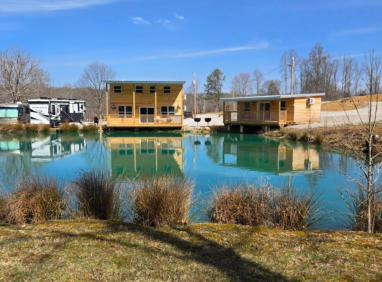 two of our cabins overlooking our stocked pond